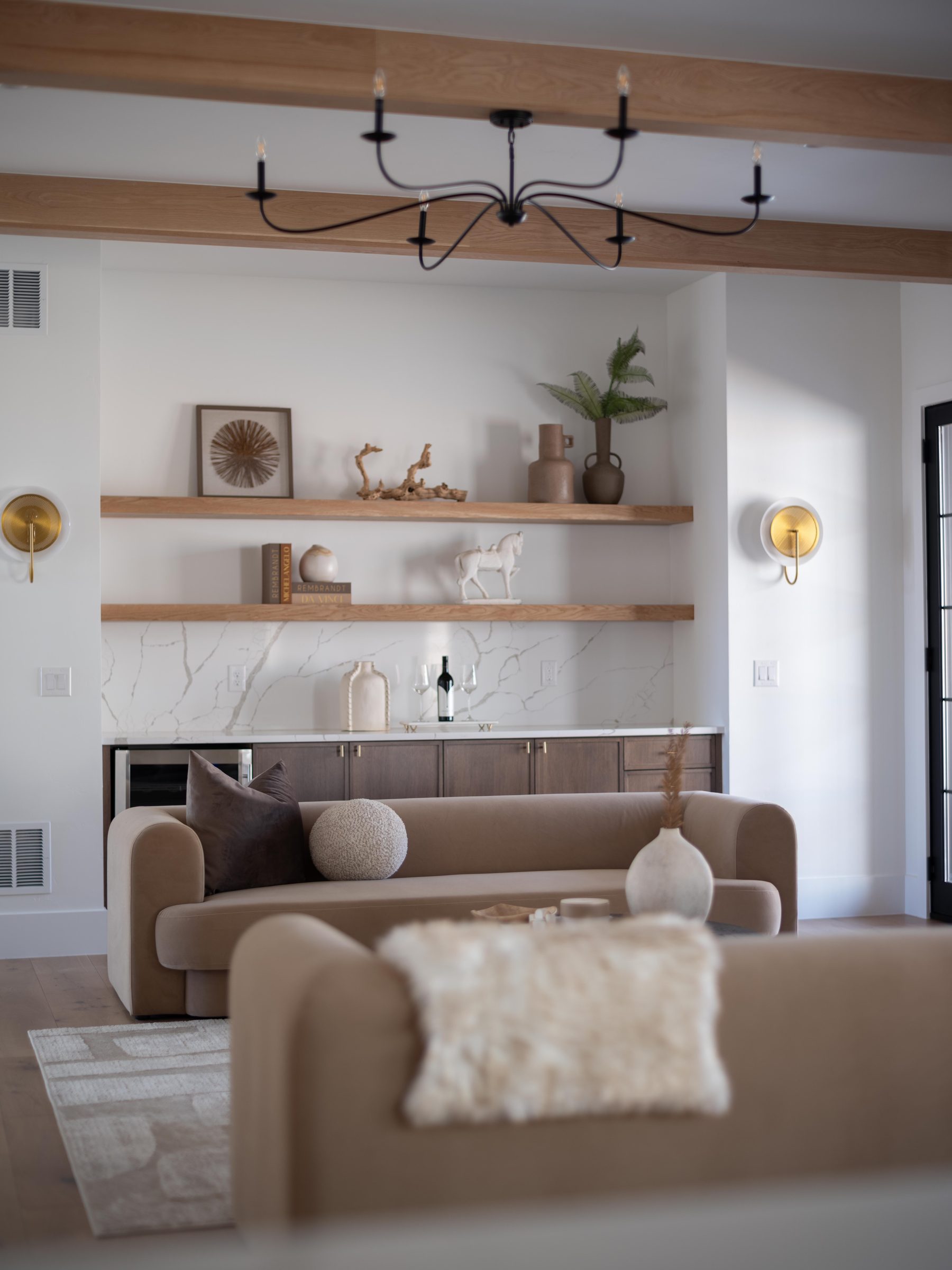Bright staged living room with layered neutrals